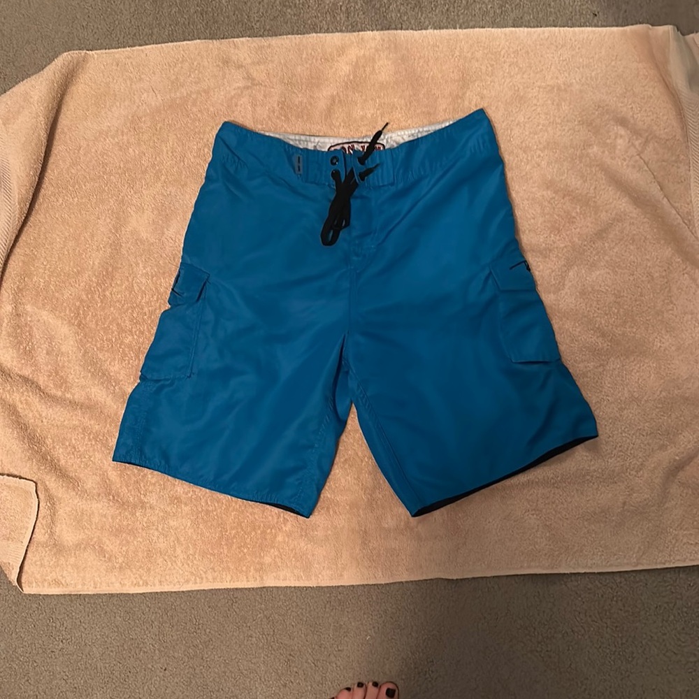 Ron Jon's Men's blue swim trunks. Waist/size: 31